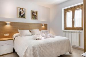 A bed or beds in a room at Casa Marosa
