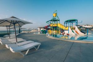 a pool with a water park with a roller coaster at Iberostar Selection Kuriat Palace in Monastir