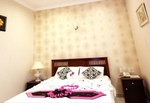 Postel nebo postele na pokoji v ubytování Nathalie's Vung Tau Hotel