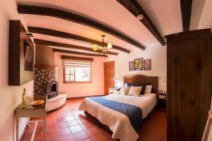 Postel nebo postele na pokoji v ubytování Hosteria Caballo Campana + 54 fotografií