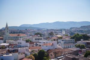 a view of a city with a church and buildings at STALO HOTEL in Piumhi