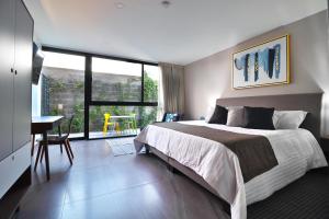Voodi või voodid majutusasutuse Arboleda 5 Luxury Lofts toas