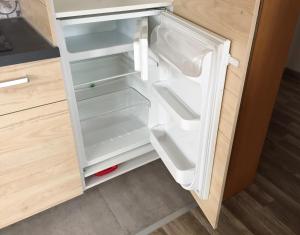 an empty refrigerator with its door open in a kitchen at Apartment No. 121 in Rottweil