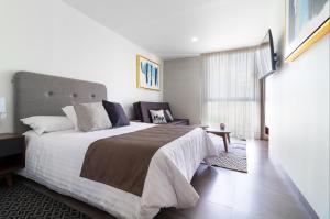 Voodi või voodid majutusasutuse Arboleda 5 Luxury Lofts toas
