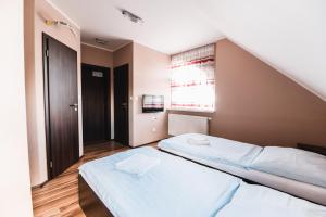 Postel nebo postele na pokoji v ubytování Motel ARD