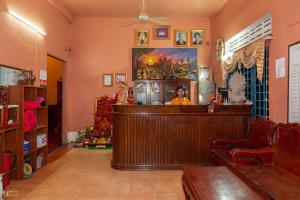 a living room filled with furniture and decorations at Blossoming Romduol Boutique in Siem Reap