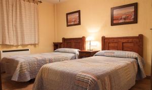 A bed or beds in a room at Alojamientos rurales el hosquillo, lugar de bienestar