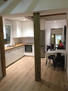a kitchen and dining room with a table and a dining room at Great apartment with excellent location (Calle Fuencarral/Gran Via/Chueca) in Madrid