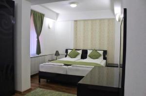 Postel nebo postele na pokoji v ubytování Hotel Fontana