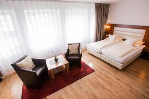 Postel nebo postele na pokoji v ubytování ZUM ZIEL Hotel Grenzach-Wyhlen bei Basel