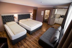 Postel nebo postele na pokoji v ubytování ZUM ZIEL Hotel Grenzach-Wyhlen bei Basel
