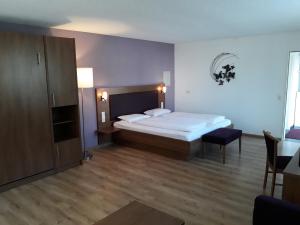 Postel nebo postele na pokoji v ubytování Gasthaus Hotel Kranz