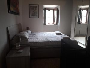 Ein Bett oder Betten in einem Zimmer der Unterkunft La Casetta in piazza