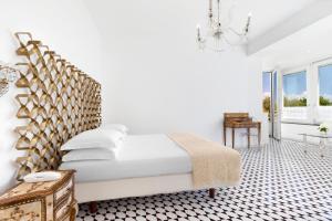 Postel nebo postele na pokoji v ubytování Villa Oriana Relais