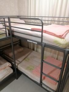 a group of bunk beds in a room at Jayleen Clarke Quay Hotel in Singapore