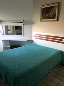 Katil atau katil-katil dalam bilik di Apartamento Velozo Santos