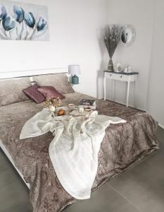a bed with a tray of food on it at Studio Apartment "Brigita",free parking in Rijeka