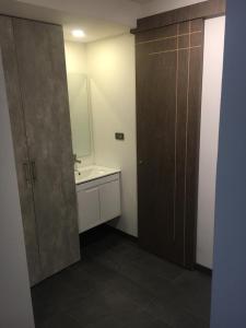 a bathroom with a sink and a mirror at HOTEL ZARCILLEJO in Pasto