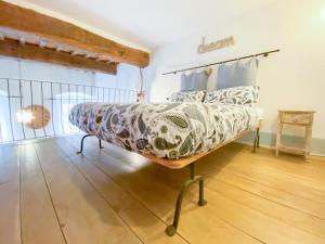 A bed or beds in a room at Gioielli Di Priori