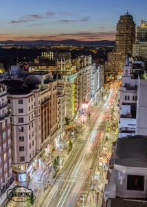 an overhead view of a city street at night at Charming Gran Vía Callao in Madrid