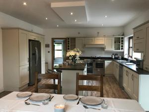 a kitchen with a table with two plates on it at Lakeview Lodge in Monaghan