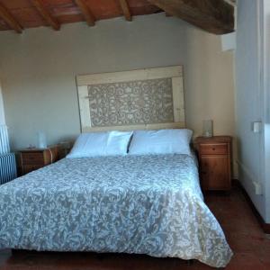 Un pat sau paturi într-o cameră la Casa Toscana Mugello