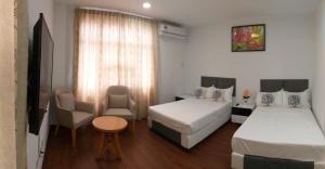 Ein Bett oder Betten in einem Zimmer der Unterkunft Coconut Bay Lodge