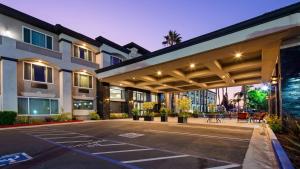 an empty parking lot in front of a building at Best Western Plus - Anaheim Orange County Hotel in Placentia