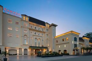 a rendering of a hotel with two buildings at Ramada by Wyndham Kapurthala in Kapūrthala