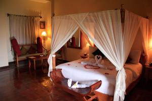 Voodi või voodid majutusasutuse Junjungan Ubud Hotel and Spa toas