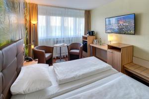 Ein Bett oder Betten in einem Zimmer der Unterkunft AHORN Panorama Hotel Oberhof