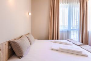 Кровать или кровати в номере Guest House Theona