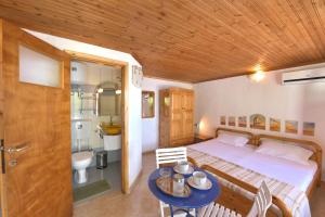 Posteľ alebo postele v izbe v ubytovaní Secret Sporades Panoramic Residence