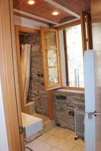 a bathroom with a sink and a window at Duplex para 4 en Cercs, Berga- A 30 mins del Pedraforca in Sant Corneli de Cercs 