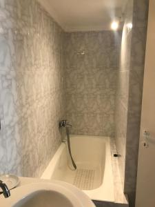 a bathroom with a bath tub and a sink at Romantika in Platis Gialos +36 photos