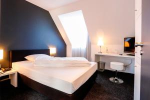Postel nebo postele na pokoji v ubytování Hotel Schempp