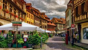 a street in an old town with buildings at Les apparts du marché in Obernai