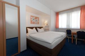 Katil atau katil-katil dalam bilik di PrivatHotel Probst