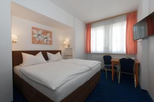Katil atau katil-katil dalam bilik di PrivatHotel Probst