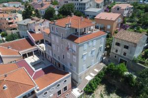 an overhead view of a large building with red roofs at Losinj Panorama Penthouse in Mali Lošinj