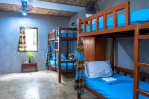 Voodi või voodid majutusasutuse Sinag Hostel toas
