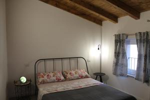 Ένα ή περισσότερα κρεβάτια σε δωμάτιο στο Casa Lia
