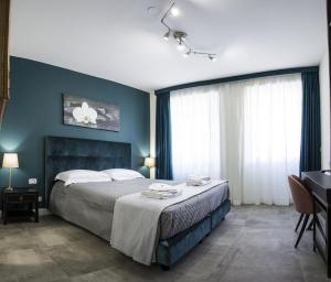 Postel nebo postele na pokoji v ubytování Regolo Rooms Vaticano