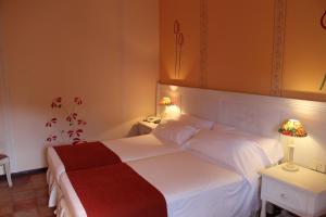 Postel nebo postele na pokoji v ubytování Hotel La Posada De Alameda