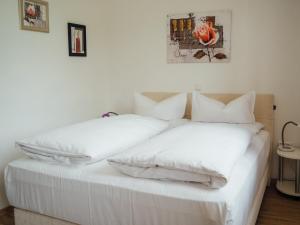 Säng eller sängar i ett rum på Hotel Garni Ammergauer Hof