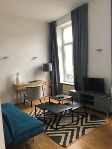 TV a/nebo společenská místnost v ubytování Hotel Vauban