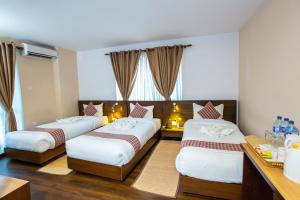 Postel nebo postele na pokoji v ubytování Kathmandu Suite Home