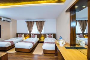 Postel nebo postele na pokoji v ubytování Kathmandu Suite Home