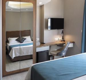 A bed or beds in a room at GALATAHAN Hotel Istanbul Karakoy