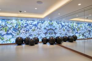 a row of black balls on a bowling alley at Les Suites at The Cliff Bay - PortoBay in Funchal